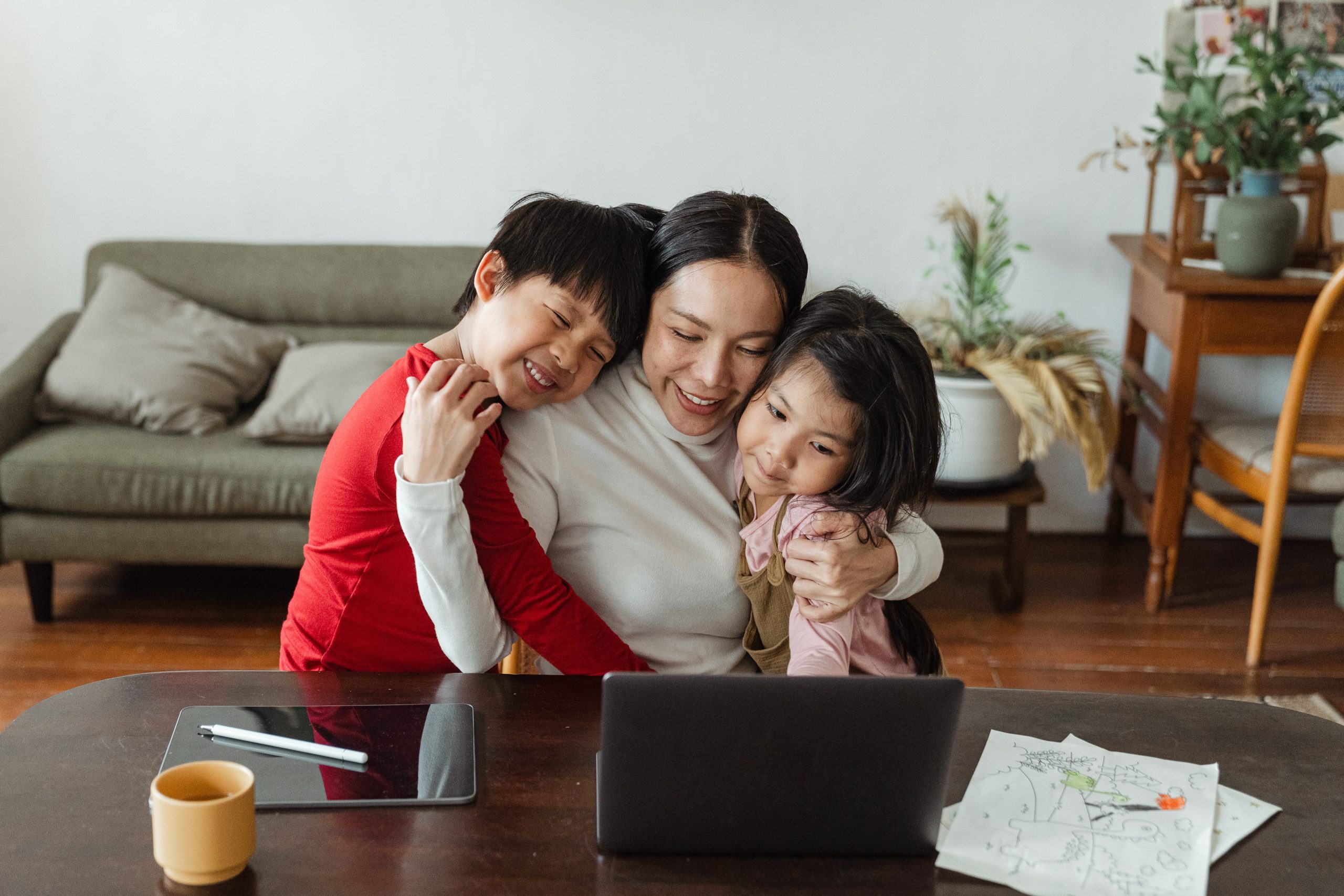 mom hugs son and daughter